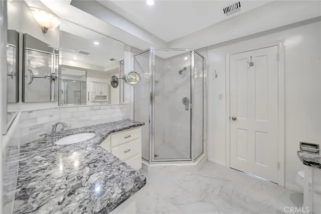 a white toilet sitting next to a shower curtain