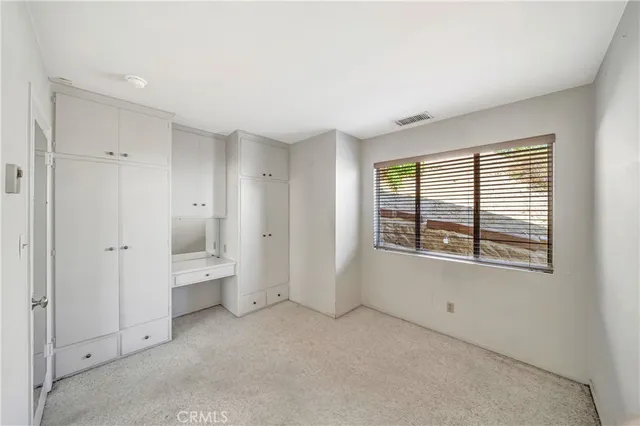 a view of storage and utility room with washer and dryer