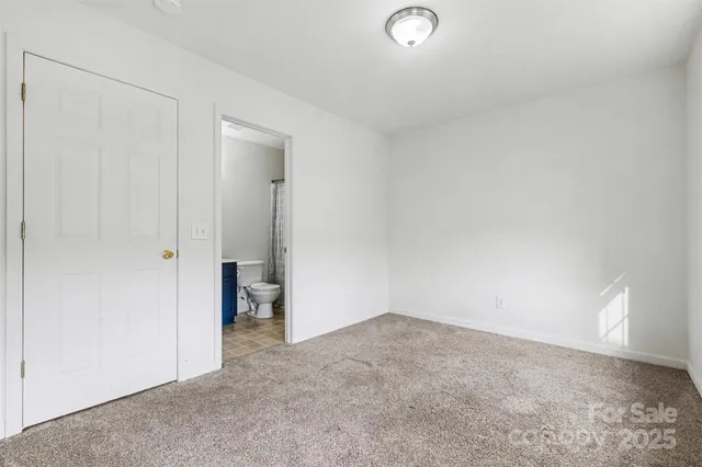 a view of an empty room and fire place