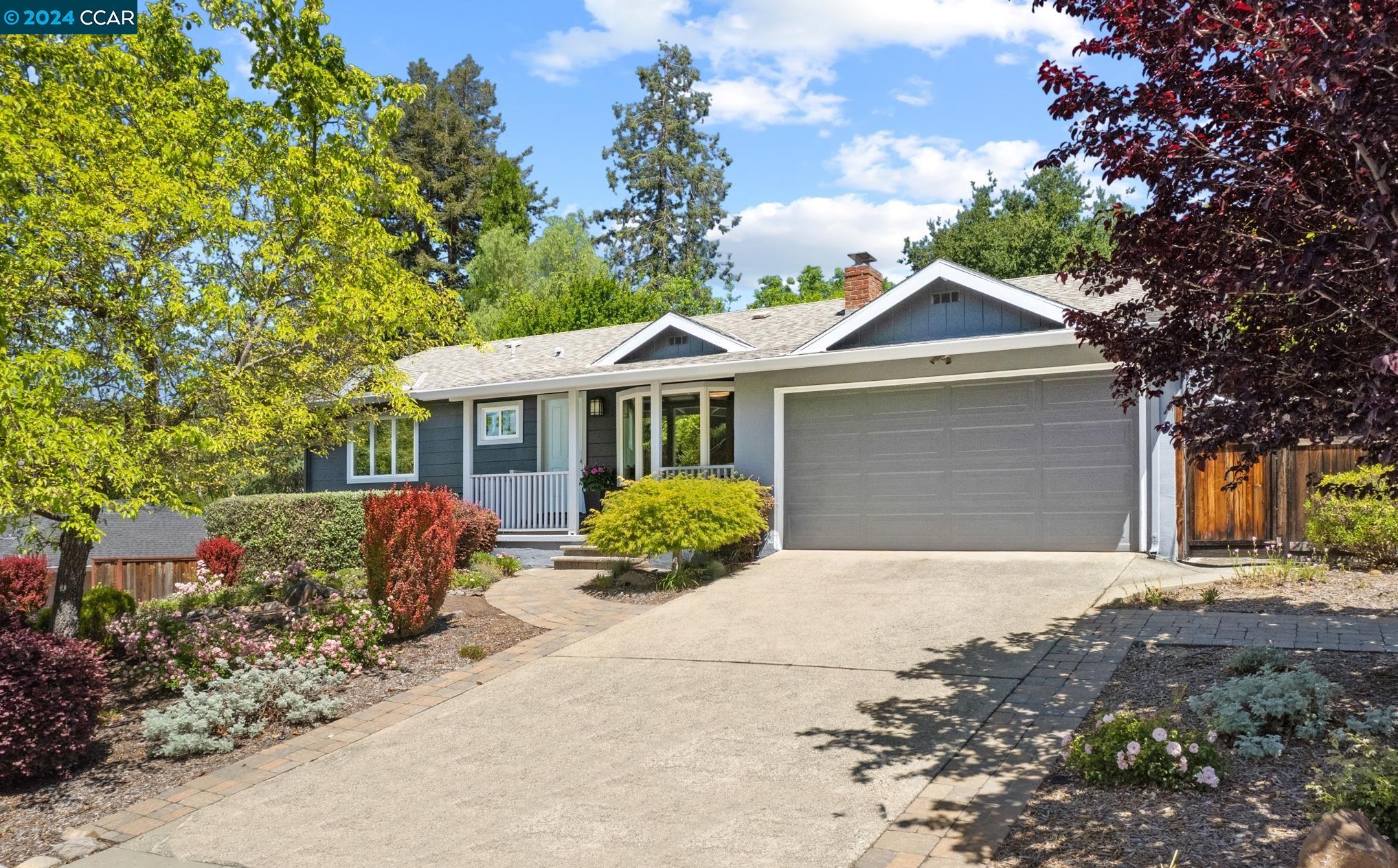 a front view of a house with garden