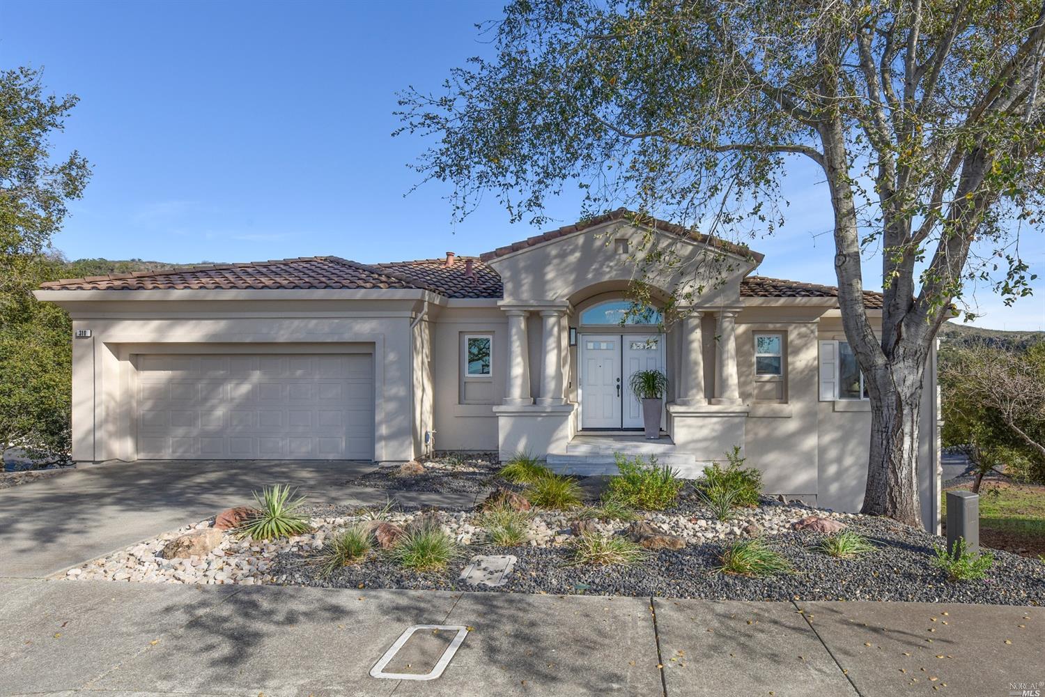 310 Alta Mesa Circle Napa, CA 94558 - Photo 1 of 1 a front view of a house with garden