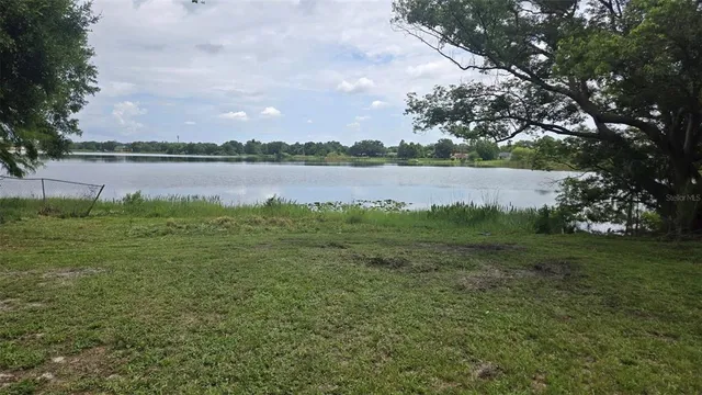 a view of lake with green space