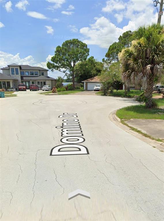 Domino Court Orlando, FL 32805 - Photo 6 of 7 a view of street with houses