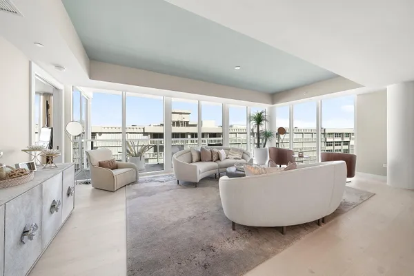a kitchen with granite countertop white cabinets and stainless steel appliances