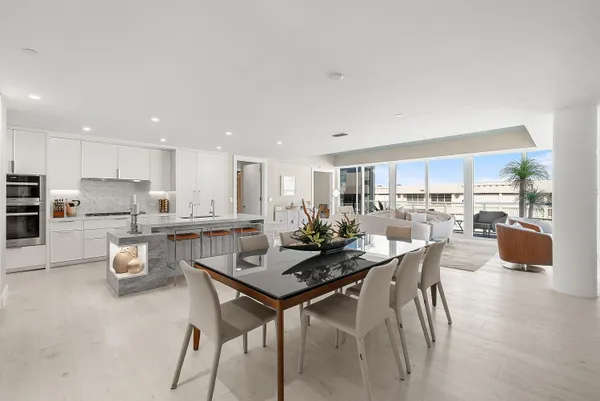 a bedroom with a large bed and a flat screen tv