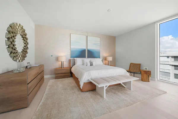 a spacious bathroom with a double vanity sink and a large mirror