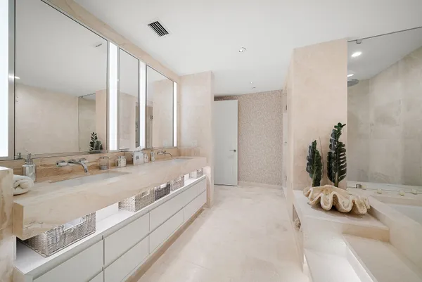 a bedroom with a bed and a lamp