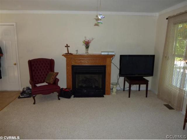 17600 Templeton Road Disputanta, VA 23842 - Photo 11 of 12 a living room with furniture and a fireplace