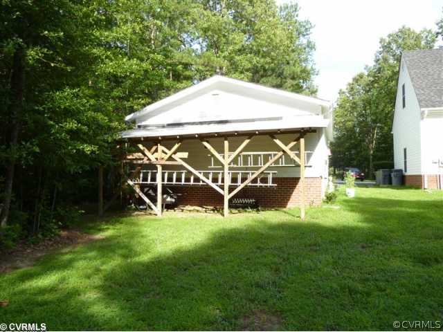 17600 Templeton Road Disputanta, VA 23842 - Photo 5 of 12 a view of a house with backyard