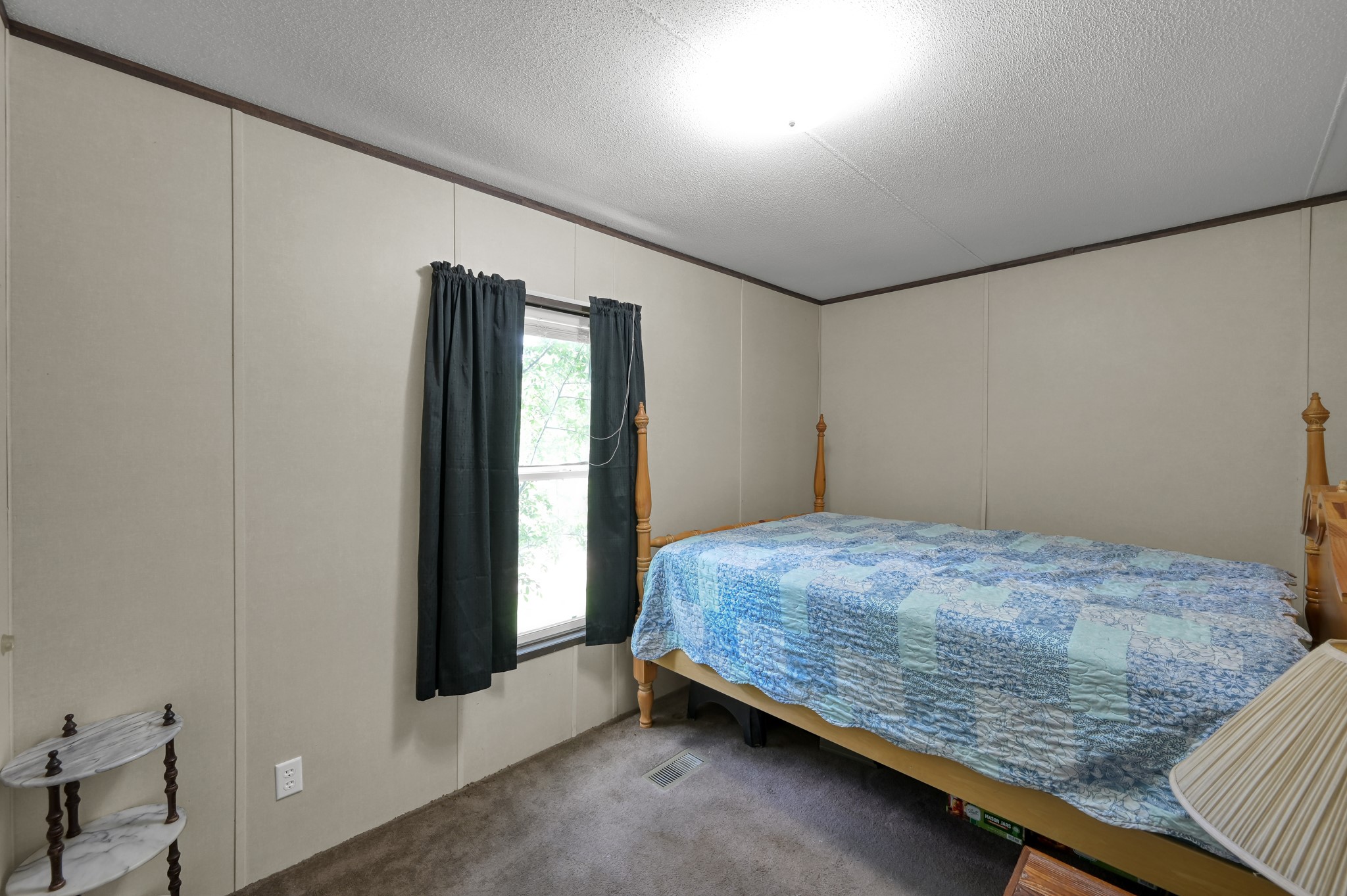 400 Raven Hill Road Oakhurst, TX 77359 - Photo 26 of 45 a bedroom with a bed and a window