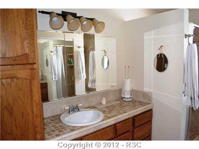 6755 Burrows Road Colorado Springs, CO 80908 - Photo 9 of 16 RENNOVATED MASTER BATH WITH ALL NEW TILE AND FIXTURES.