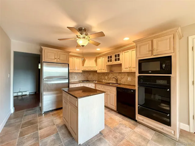 a kitchen with a stove and a refrigerator