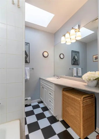 a kitchen with a sink a stove and cabinets