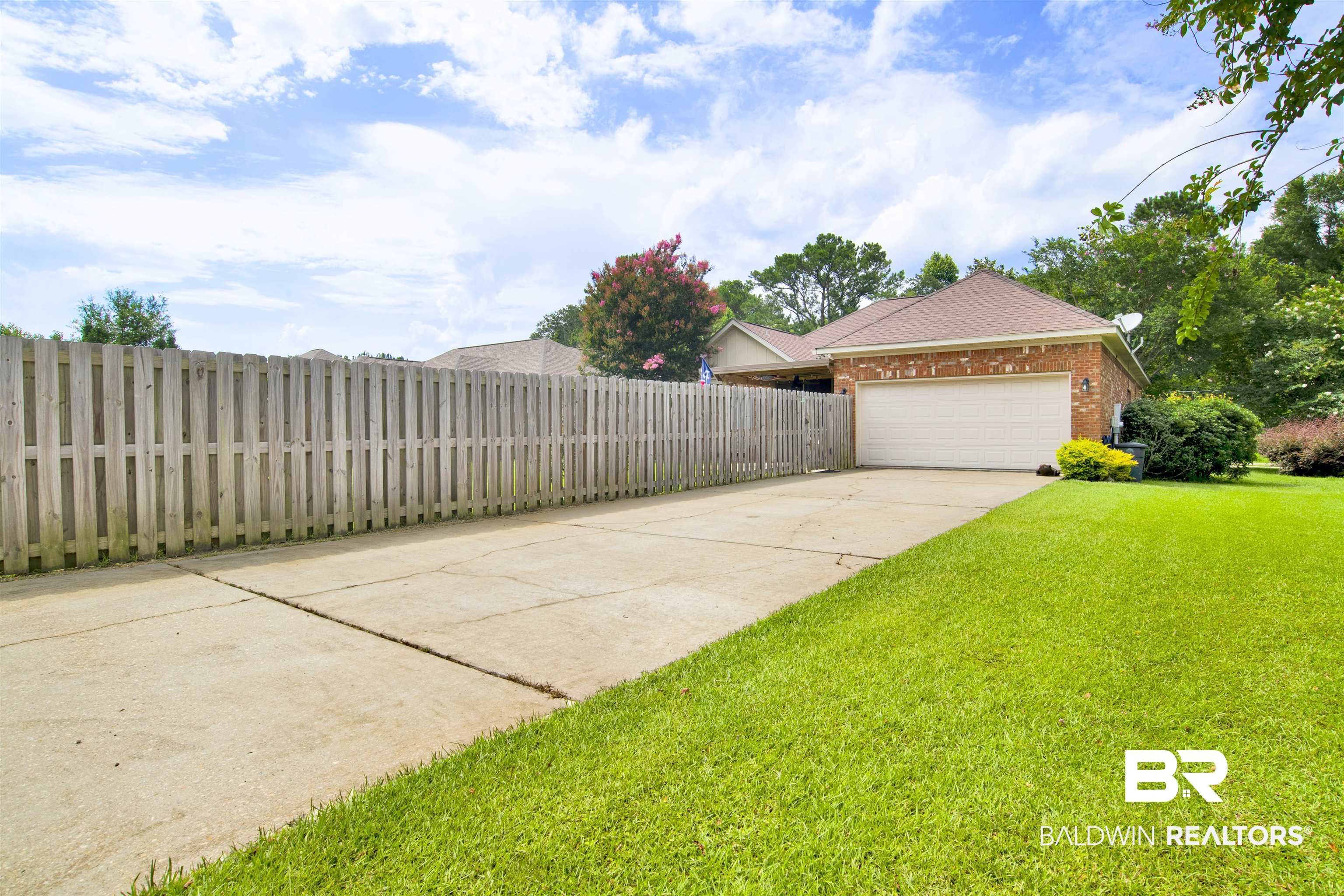 10368 Gayfer Rd Extension Fairhope, AL 36532 - Photo 41 of 43 Brick exterior home featuring a two-car garage
