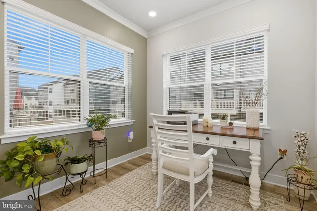a dining room with furniture and windows