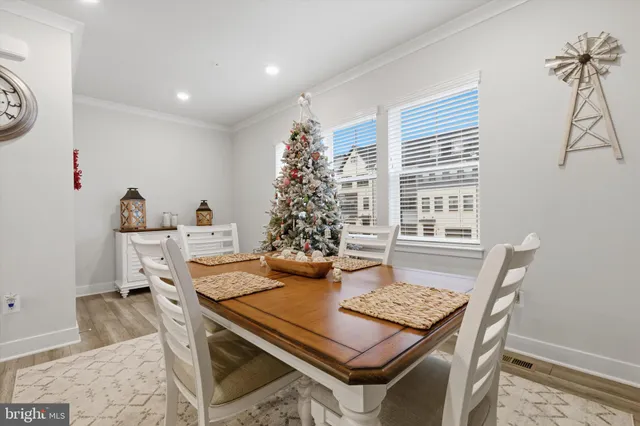 a view of a dining room with furniture and window