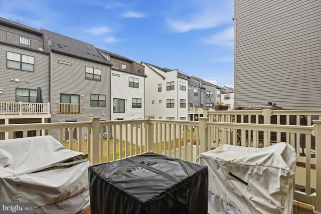 a view of a patio with couches chairs and potted plants