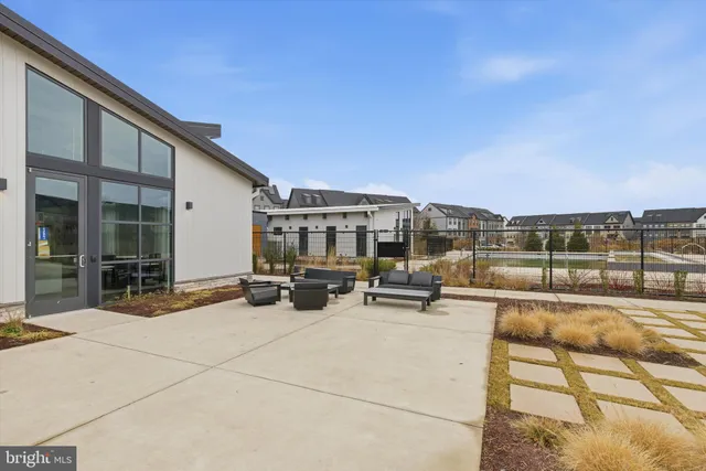 a view of a swimming pool with an outdoor seating