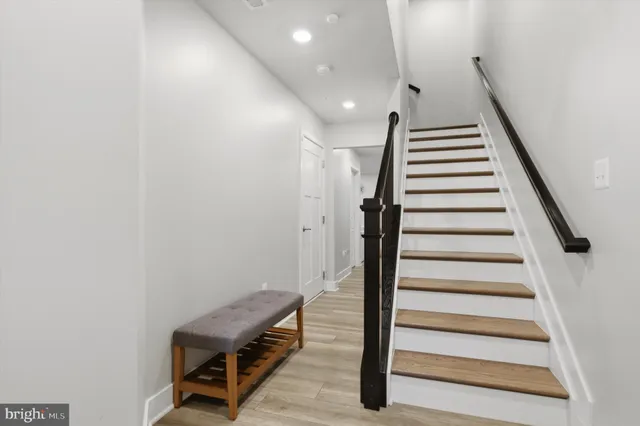 a view of entryway with stairs and wooden floor