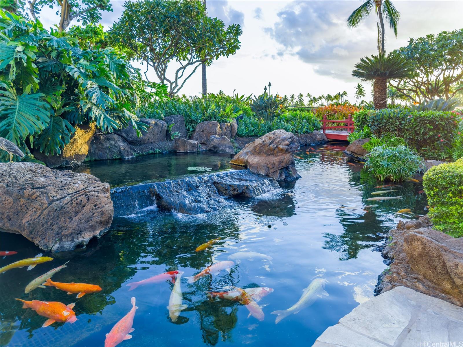 92-104 Waialii Place, Unit O712 Kapolei, HI 96707 - Photo 18 of 25 a view of backyard with outdoor seating and trees