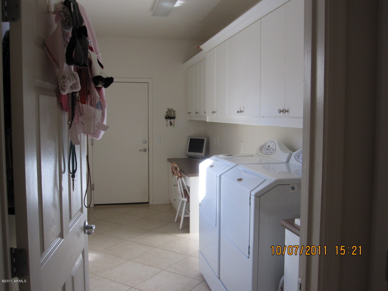 42449 Abbey Road Maricopa, AZ 85138 - Photo 18 of 19 Built in cabinets in the laundry room