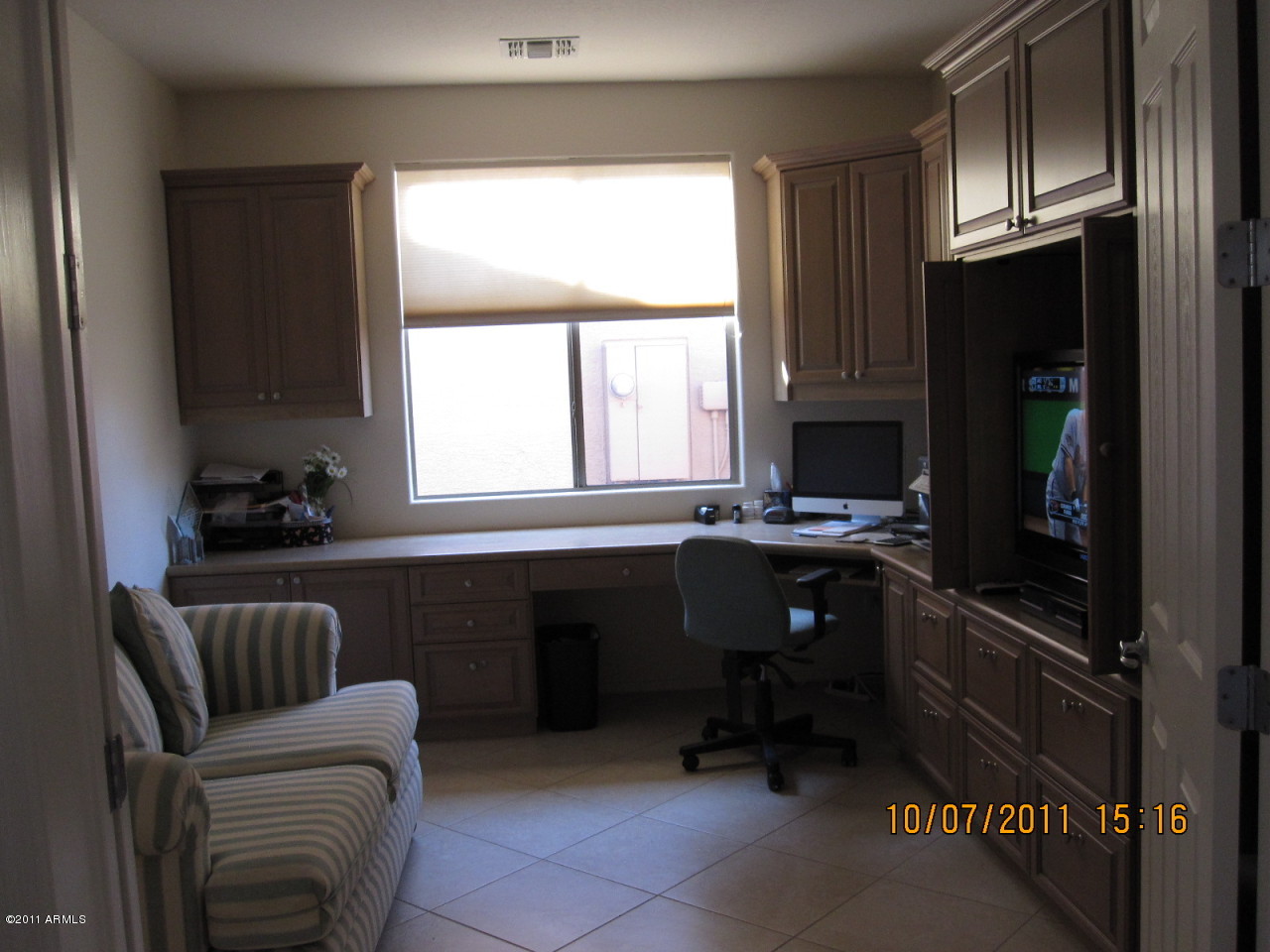 42449 Abbey Road Maricopa, AZ 85138 - Photo 4 of 19 Built in desk and cabinets in the den