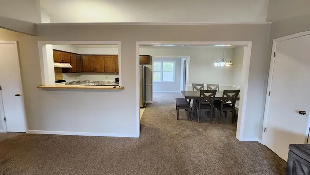 a view of a livingroom with furniture and a flat screen tv