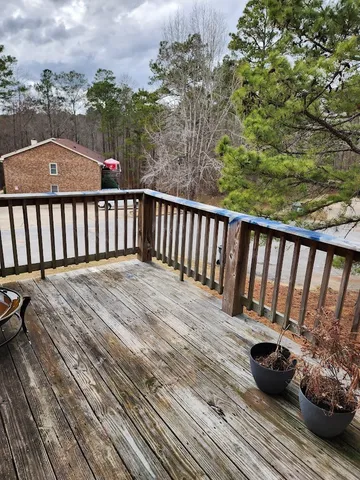 a view of balcony with furniture