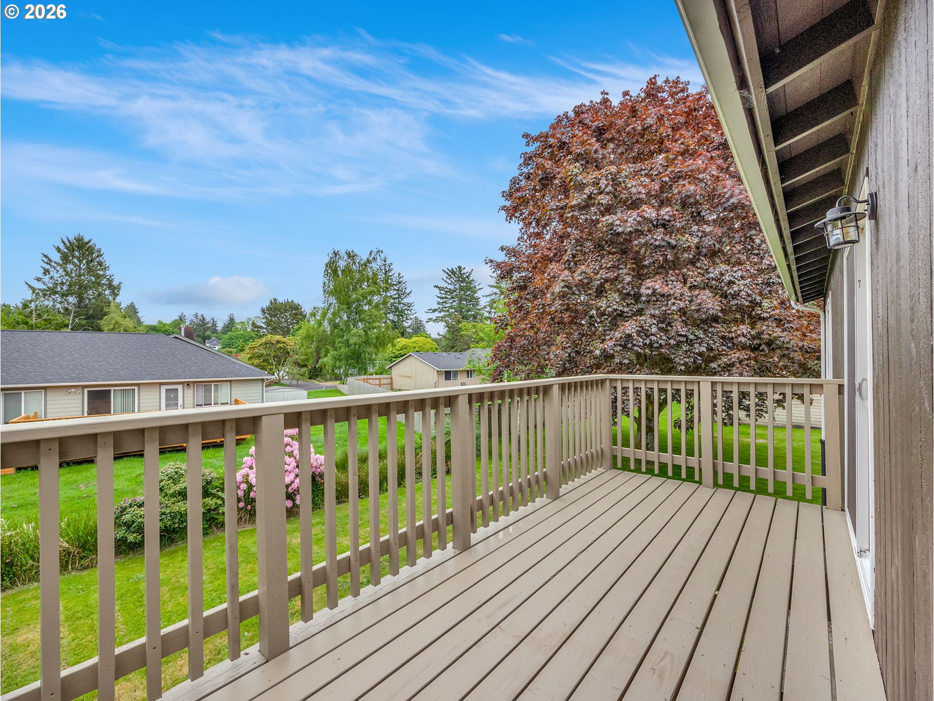 91923 Ridge Road Warrenton, OR 97146 - Photo 14 of 35 a balcony with wooden floor and fence