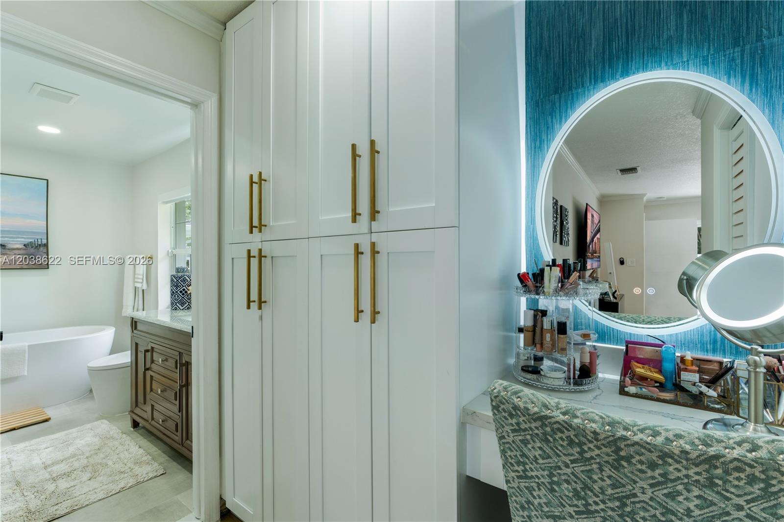 14830 Southwest 149th Street Miami, FL 33196 - Photo 15 of 43 a bathroom with a granite countertop sink a toilet and a mirror