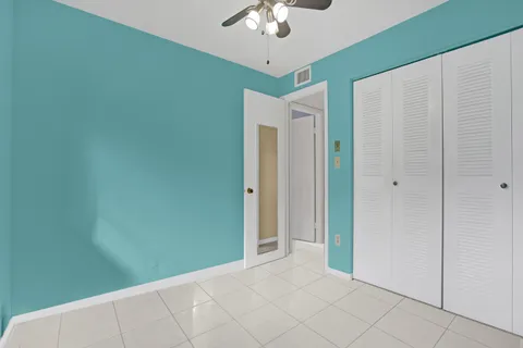 a view of a livingroom with a chandelier fan