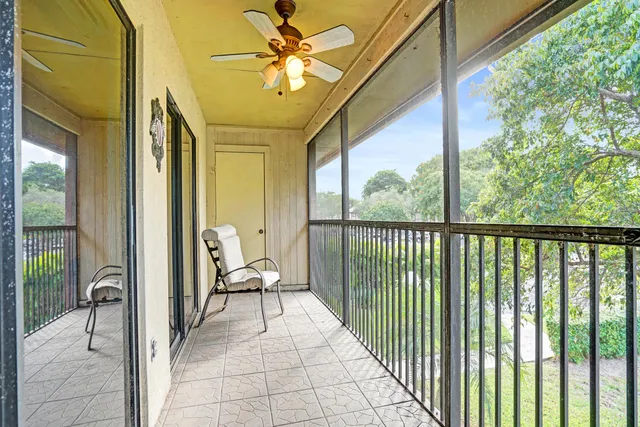a view of a balcony with furniture