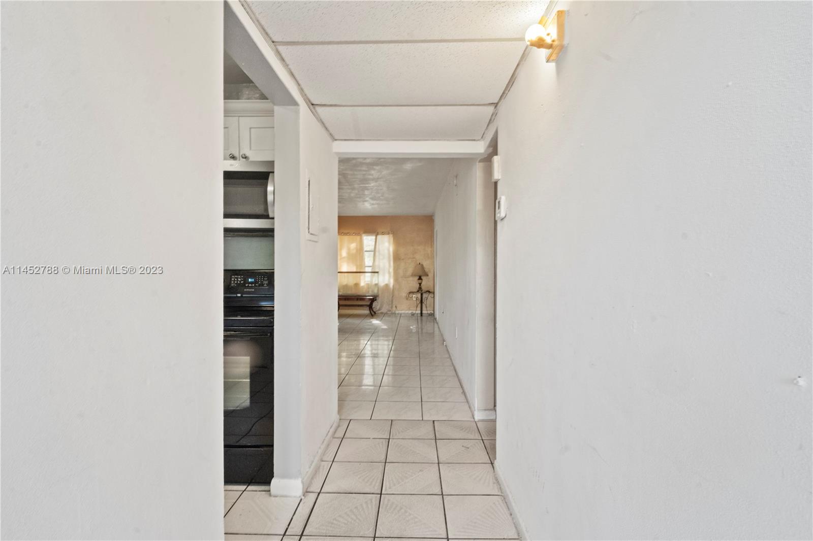 Norland Miami, FL 33179 - Photo 3 of 15 a view of a hallway with wooden floor and staircase