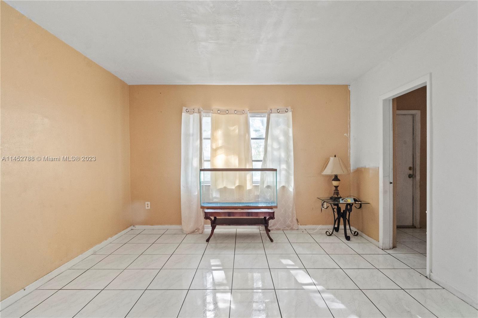 Norland Miami, FL 33179 - Photo 8 of 15 a view of an empty room with a window