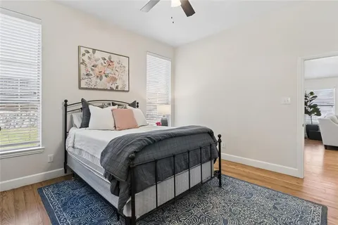 a bedroom with a bed and a rug