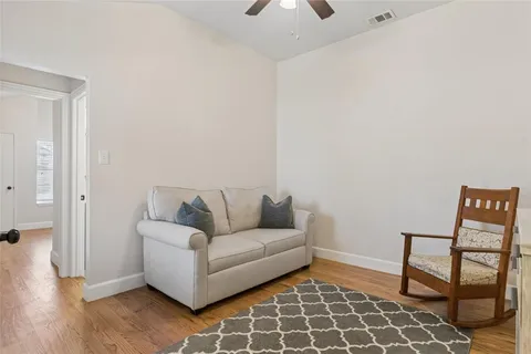 a living room with furniture and a rug
