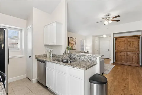 a kitchen with a table and chairs