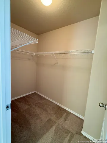 a kitchen with a sink and a stove top oven