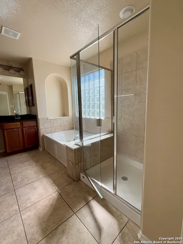 a bathroom with a tub and shower
