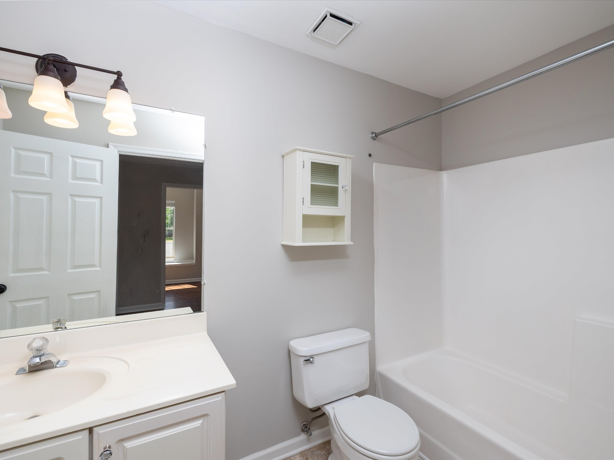 4629 Sandy Creek Road Nashville, TN 37221 - Photo 24 of 48 a bathroom with a toilet sink vanity and mirror