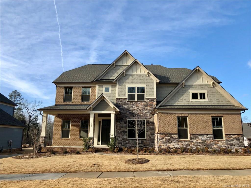 7003 Fallondale Road, Unit MB515 Waxhaw, NC 28173 - Photo 1 of 10 a front view of a house with garden