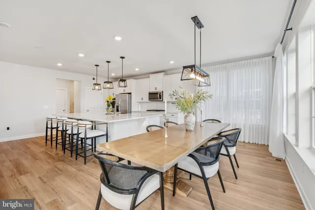 a view of entryway with wooden floor and stairs