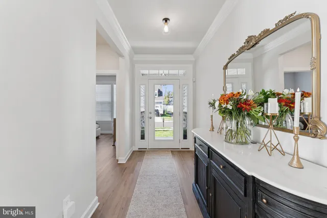 a bathroom with a sink vanity mirror and toilet