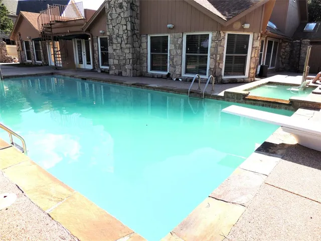 a view of swimming pool with seating space