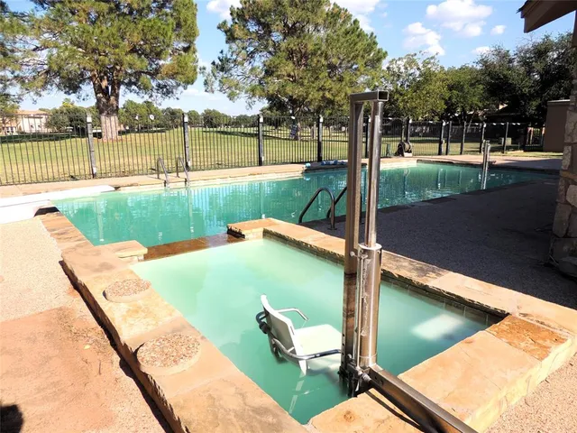 a view of a backyard with a garden and trees