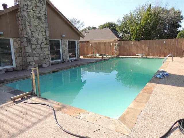 a view of a house with a swimming pool