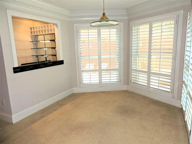 a view of an empty room with windows