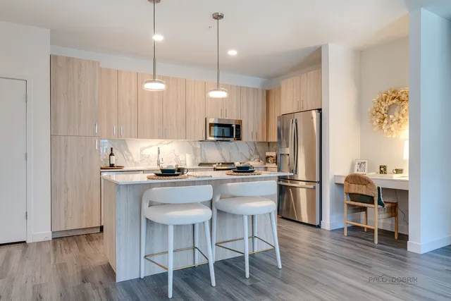 a view of kitchen with cabinets and wooden floor