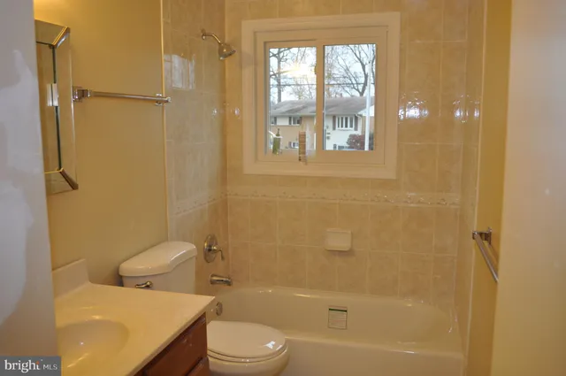 a bathroom with a toilet and shower