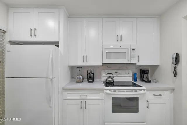 a view of a swimming pool with outdoor seating
